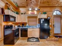 Full kitchen in this affordable 1 bedroom cabin near Pigeon Forge